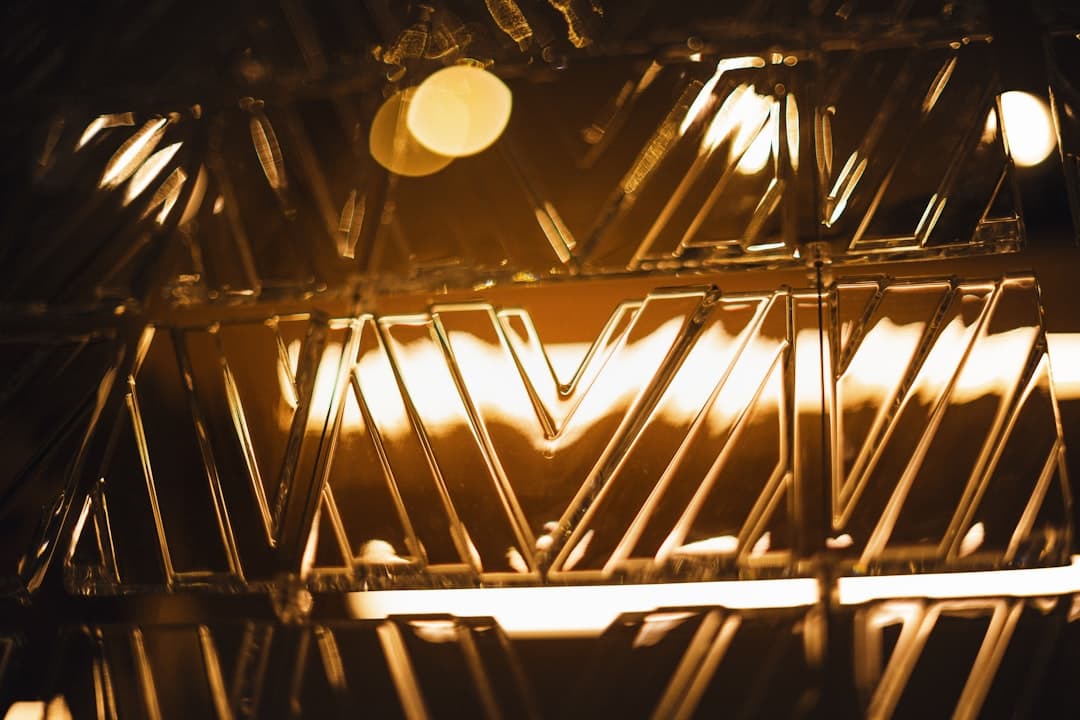 a close up of a metal rack with lights in the background